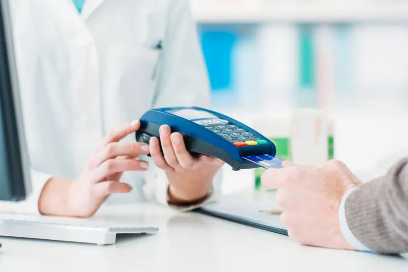 patient-paying-for-dental-procedure-5